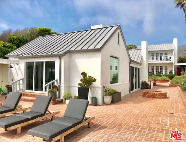 The ultimate Malibu beach lifestyle. Two bungalow homes on a wide 55' beachfront lot. Main house plus a large detached guesthouse with three-bedrooms and two and a half bathrooms. Completely updated and lavishly designed to be the ultimate beach hangout. Deep sandy private backyard for endless entertaining. Gourmet kitchen with SubZero and Wolf appliances.