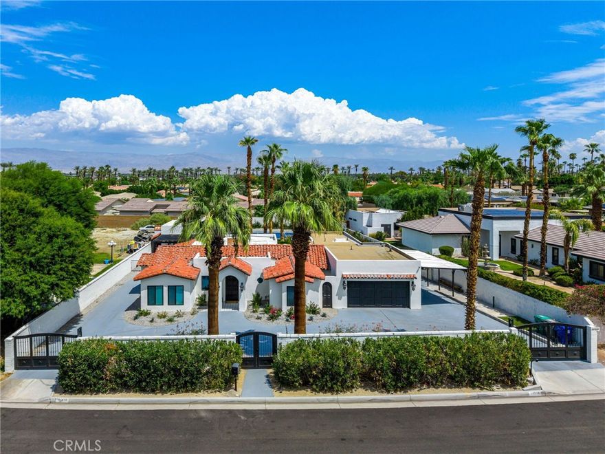 Welcome to Your Private Palm Desert Hacienda compound! Discover this one-of-a-kind, gated resort-style estate nestled just blocks from the world-renowned El Paseo shopping district. Originally built in 1949 for famed actress Mrs. Mabley—also known as Ma Kettle—this historic property blends timeless charm with modern luxury across a sprawling 19,000+ sq ft lot. Main Residence Highlights include: Over 3,400 sq ft of living space, 4 spacious bedrooms & 3.5 bathrooms, grand living room with dramatic wood-beamed ceilings and a floor-to-ceiling fireplace, gourmet kitchen featuring brand-new custom cabinetry, granite countertops, oversized island, and top-of-the-line Viking appliances, elegant family room with hardwood floors and expansive multi-slide glass doors opening to the entertainer’s backyard. The Primary Suite offers vaulted ceilings, a spa-inspired bathroom with dual shower heads with luxurious finishes and a private gym for your wellness needs. The 2 detached Casitas are ideal for guests or multi-generational living, each with its own covered patio perfect for al fresco dining. The outdoor oasis has a sparkling pebble tec pool and spa, pickleball court for active fun, outdoor bathroom and shower, built-in BBQ station for hosting unforgettable gatherings, and breathtaking mountain views that offer peace and privacy. Whether you're seeking a serene sanctuary or a vibrant venue for entertaining, this estate offers endless possibilities to personalize and elevate your lifestyle. Properties of this caliber and character rarely come to market—don’t miss your chance to own a piece of Palm Desert history.