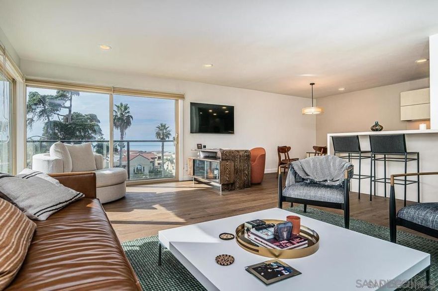 This fully furnished property is available for mid-, and long-term rentals. Rates are subject to change based on seasonality and length of stay. This top-floor, oceanfront condo is ideally located in the heart of La Jolla Village, directly across from the coastline. Boasting 2 beds and 2 baths, this corner unit offers breathtaking views of the Pacific Ocean. Stroll effortlessly through the seaside neighborhood to explore La Jolla Village’s charming shops, vibrant restaurants, recreational facilities, stunning beaches, and more! The living room features floor-to-ceiling windows that showcase stunning ocean views, allowing you to relax and take in the picturesque sunsets. A comfortable leather couch and oversized chair create a cozy space to unwind, while a large flatscreen TV and a convenient desk area provide options for entertainment or working remote. The living area flows seamlessly into the dining area as well as the newly remodeled kitchen, featuring a modern design and new top-of-the-line Bosch appliances. With barstool seating for two, it’s an ideal spot for morning coffee or casual meals. The primary bedroom is a serene retreat with a king-sized bed, built-in clothing storage, and a Frame TV for relaxation. The en-suite bathroom offers a dual vanity and shower. The second bedroom features a queen-sized bed and a built-in workspace, perfect for guests who need a dedicated area to work. The second bathroom includes a shower/tub combo. This condo offers additional amenities to enhance your stay, including air conditioning, high-speed WiFi, in-unit washer and dryer, and two underground garage spaces. Pet-friendly and walkable to all the best spots in La Jolla Village, it’s perfect for families or groups looking to explore. Guests also have access to the complex’s pool, BBQ, and entertaining area, making this the ideal coastal escape. Whether you’re here for a relaxing beach getaway or an active adventure, this condo has it all. Sleeping Accommodations (Maximum Occupancy 4): Bedroom 1: 1 King bed Bedroom 2: 1 Queen bed