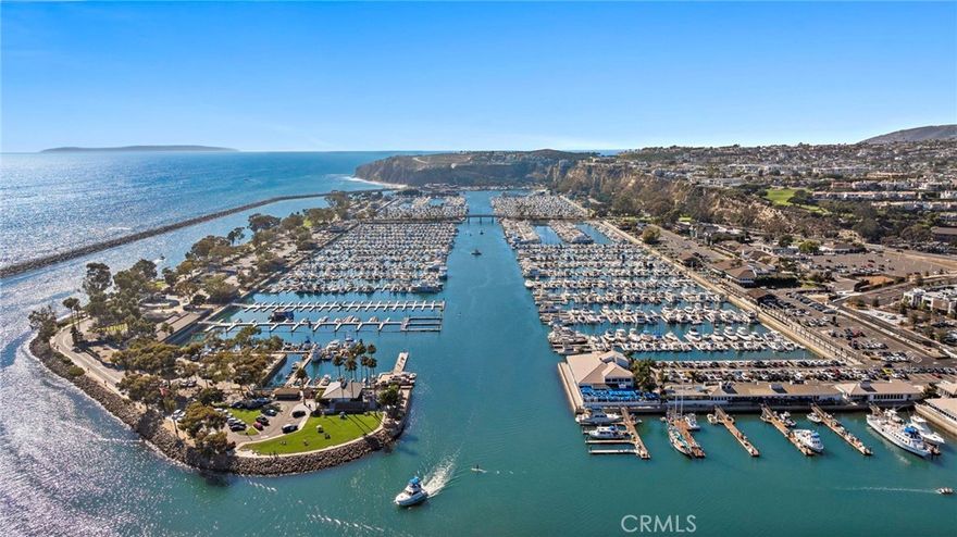 Location, location, location!  Just off PCH and Dana Point Harbor nestled in the gated community of Spinnaker Run, this first-floor unit offers a bright, inviting space with wood flooring, crown molding, and ceiling fans throughout. The kitchen features stainless steel appliances, large stainless steel sink, tile backsplash and spacious dining area. The living room opens to a private patio, perfect for relaxing or taking in the ocean breeze. The bedroom boasts plantation shutters and a large walk-in closet, providing ample closet space and storage. Community offers pool, spa and nearby park, tennis, pickleball, and baseball fields. Enjoy the trail close by that leads to Doheny Beach, Obispo Park, and Dana Point Harbor. This location offers it all - close to dining, shopping, and the freeway, the conveniences are endless.  If you are looking for coastal life living, this is the home for you.