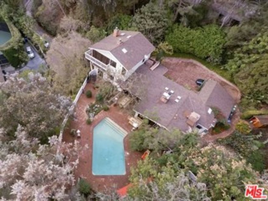 Incredible opportunity to build your dream estate! Located on one of the most coveted streets in lower Beverly Hills, this property is just doors away from Jay Leno, Lisa Kudrow and Bruce Springsteen. Plans included in the sale for a 16,500  square foot home (option to build a smaller 12,000 square foot house available). Renderings illustrate a stunning Hamptons-style traditional for this sprawling compound. Plans are ready for submittal to the city. Sellers have slope band analysis, survey, topos, and soils reports. Bring your shovel!