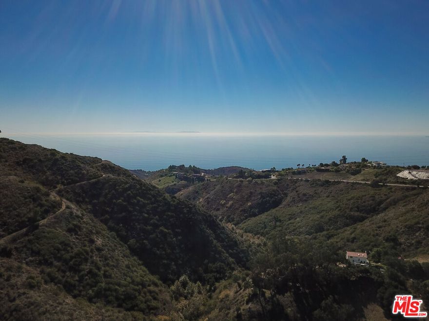 An incredible opportunity to finish creating your own architectural masterpiece in the heart of Malibu's coveted lower Latigo Canyon. This exceptional rebuild property has a lot size of appx 6,260 SF and comes with active building permits and completed Phase 1 construction including the foundation, utilities, and partial framing allowing you to jump right into the build process. The approved plans feature a stunning two-story modern home of approximately 1,223 SF, designed to capture breathtaking ocean views from every room and complemented by an expansive 871 SF rooftop deck perfect for soaking in the sweeping canyon and coastline vistas. The design also includes an attached 448 SF two-car garage for convenience and functionality. With water and septic systems already installed and power easily accessible from the street, much of the groundwork is complete offering a rare head start on your Malibu dream home. Ideally situated just minutes from Pacific Coast Highway, this property provides effortless access to world-class beaches, boutique shops, and acclaimed restaurants, while being surrounded by the serene beauty of Malibu's hiking and biking trails.