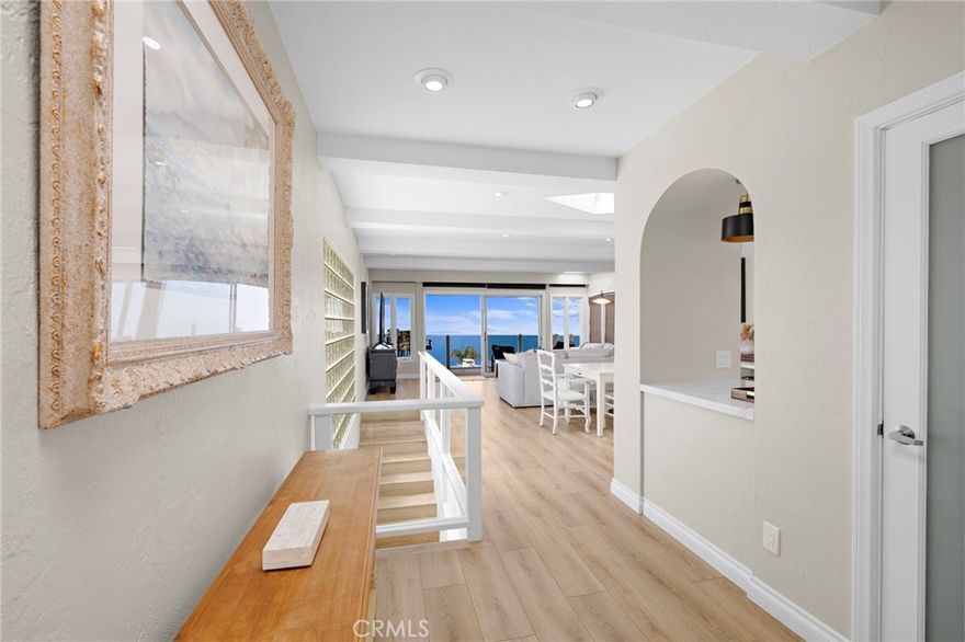 Spectacular Ocean-View Retreat in Laguna Beach



Experience breathtaking panoramic ocean views from this exceptional, fully furnished or unfurnished Laguna Beach rental perched high in the desirable Arch Beach Heights neighborhood. This beautifully appointed home offers unobstructed vistas from Catalina Island to Palos Verdes and beyond—perfectly positioned for dramatic sunsets and tranquil coastal living.



Step inside to an open-concept main level filled with natural light, soaring beamed ceilings, and sit-down ocean views from the living, dining, and kitchen areas. The remodeled kitchen features granite countertops, custom cabinetry, a walk-in pantry, and a double porcelain sink framed by a charming bay window. Glass doors open to an upper deck with sleek glass partitions—ideal for enjoying coastal breezes and postcard-worthy sunsets.



The mid-level hosts an oversized primary suite with its own private ocean-view balcony and generous , soaking tub and good closet space. A second bedroom overlooks a serene  courtyard that separates the main house from a detached studio suite with an ensuite bath—perfect for guests or a private office.



Downstairs, discover a lush, landscaped backyard retreat with an expansive deck, and an additional private bedroom and bathroom—excellent for use as a home office, gym, or guest suite. Remodeled bathrooms feature stone finishes, tiled showers, and a tub.



Warm maple hardwood floors run throughout, complemented by skylights and glass block accents that enhance the natural light. Smart home upgrades include Insteon programmable lighting and a Ring video doorbell for added convenience and security.



Located just blocks from Moulton Meadows Park—with tennis, pickleball, a soccer field, and playground—this home offers easy access to the Aliso Wood Canyon Wilderness trails, trolley and bus routes, award-winning restaurants, beach coves, and the vibrant Laguna arts scene.



Live the ultimate Laguna Beach lifestyle in this magical coastal retreat with 360° views and modern comforts.