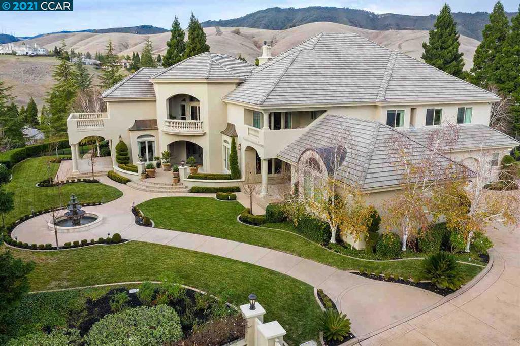 Beautifully designed and newly renovated estate situated on over 2 private acres. Surrounded by rolling hills, this lavishly appointed 9,932 square foot residence features 7 bedroom suites and 7 full bathrooms, 2 powder rooms, an expansive and well-appointed chef’s kitchen, a 12-person theatre, a spacious game room, elegant library, office and the convenience of a built-in elevator. Abundant windows throughout and private balconies allow natural light in and reveal spectacular views of the hills. Meticulously landscaped, the elegant grounds feature a charming guest house, pebble surface pool and spa with a graceful marble waterfall and slide, a full-sized tennis court, a parklike play structure, batting cage and putting green. Over $3 million in renovations, no expense was spared on this magnificent estate.