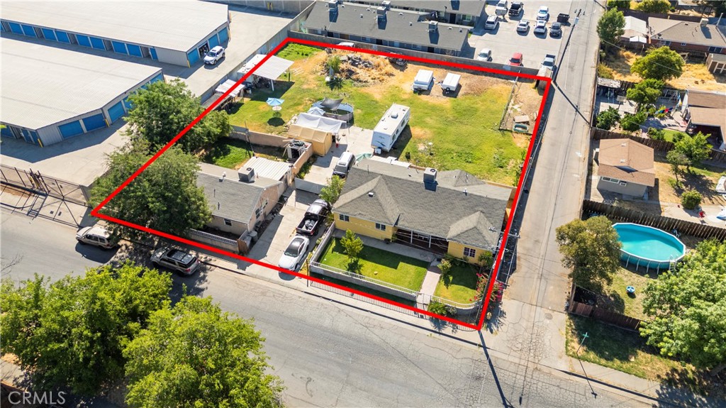 This unique property offers two separate homes on a spacious 0.34-acre lot with alley access, providing excellent potential to add more homes or even develop apartments. The front home is a 3-bedroom, 2-bathroom residence, and the second home is a 2-bedroom, 1-bathroom both currently tenant-occupied and generating steady rental income, making this a fantastic investment opportunity. The lot includes RV access and a private driveway, adding convenience and flexibility. Each home features tile flooring throughout, its own AC unit, and private yards, with additional generous front and backyard space. Located near convenience stores and everyday essentials, this property combines comfort, location, and strong income potential. Whether you're looking to expand your rental portfolio, a multi family opportunity or develop further, this lot offers endless possibilities.