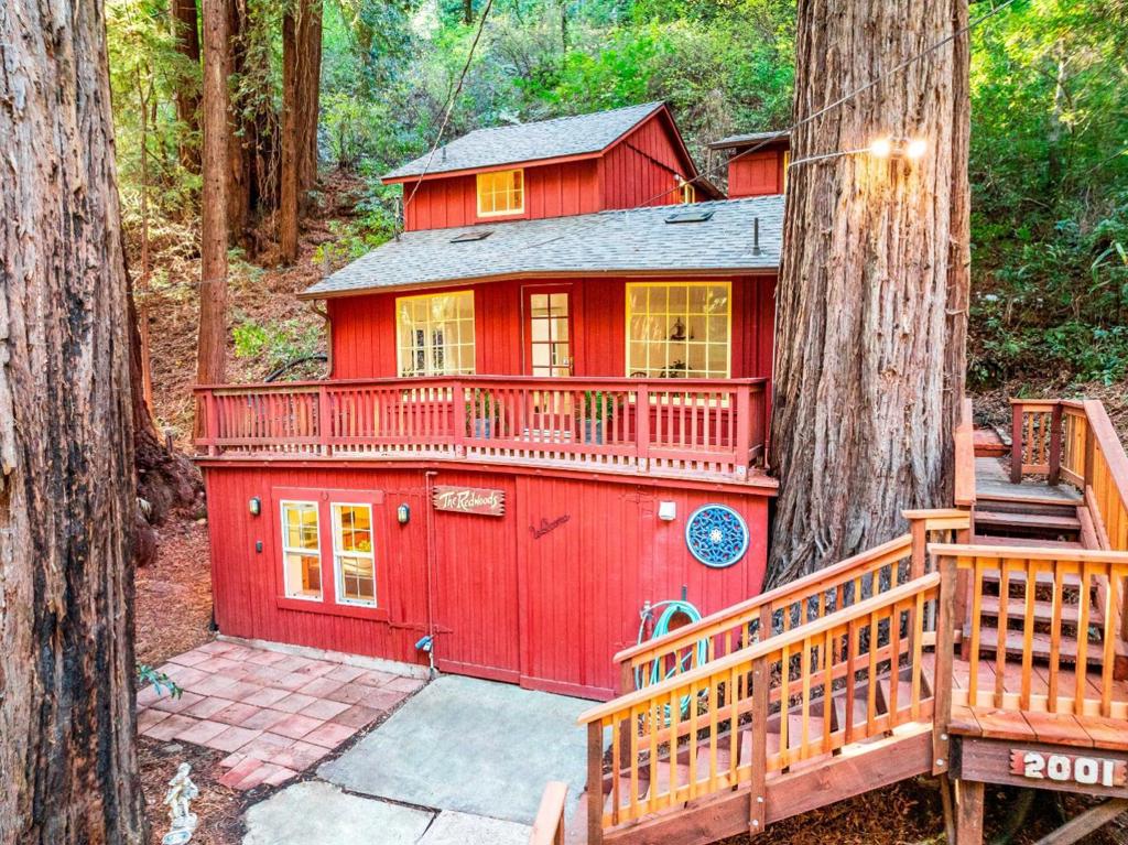 This charming 1930s cabin offers a perfect blend of rustic charm and modern updates. Just a 7-minute drive from Aptos Village and a short walk to the 10,000-acre Forest of Nisene Marks State Park. Thoughtfully updated with a new roof, fresh paint, new flooring, and more, this multi-level cabin, built with virgin redwood, is a serene retreat nestled among the majestic redwoods. Cozy up by the stone fireplace or unwind in one of the two luxurious clawfoot tubs after a day of outdoor exploration. With its unique history as a former camp counselors cabin, this delightful home is ideal for anyone seeking a peaceful escape in a natural setting while staying close to town.