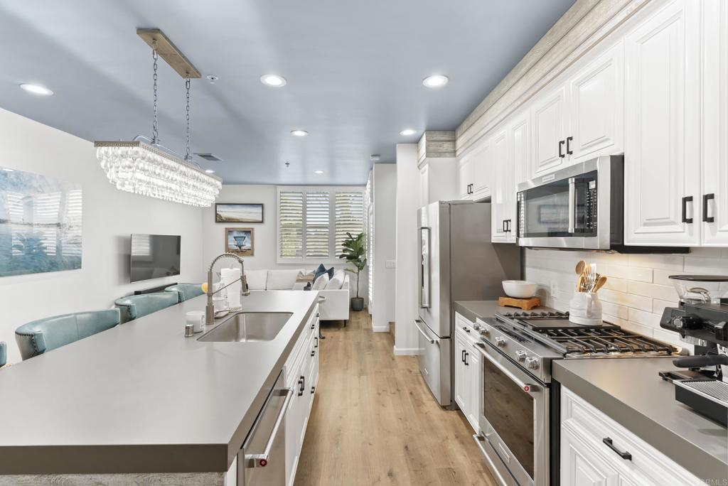Experience the best of coastal living in this beautifully turnkey 2 bedroom, 2.5 bathroom residence located in the heart of Encinitas within the secure, gated community of Pacific Station. Just steps from the city's best restaurants, cafes, shopping, nightlife, fitness studios, and only two blocks from D Street Viewpoint and Moonlight Beach. This A+ location puts you at the center of it all. Enjoy two private view decks overlooking the vibrant energy of Downtown Encinitas. From classic car shows to community events and everyday people-watching, there’s never a dull moment. Inside, you'll find modern finishes throughout and a versatile second en-suite bedroom featuring a pull-out Murphy bed—ideal as a guest room, nursery, or home office. Offered unfurnished, this rare rental opportunity blends convenience, comfort, and character in the highly desirable 92024.