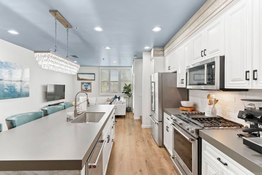 Experience the best of coastal living in this beautifully turnkey 2 bedroom, 2.5 bathroom residence located in the heart of Encinitas within the secure, gated community of Pacific Station. Just steps from the city's best restaurants, cafes, shopping, nightlife, fitness studios, and only two blocks from D Street Viewpoint and Moonlight Beach. This A+ location puts you at the center of it all. Enjoy two private view decks overlooking the vibrant energy of Downtown Encinitas. From classic car shows to community events and everyday people-watching, there’s never a dull moment. Inside, you'll find modern finishes throughout and a versatile second en-suite bedroom featuring a pull-out Murphy bed—ideal as a guest room, nursery, or home office. Offered unfurnished, this rare rental opportunity blends convenience, comfort, and character in the highly desirable 92024.