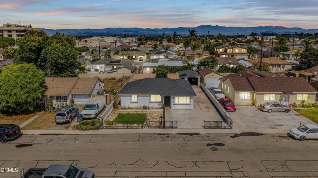 Welcome to this inviting 3-bedroom, 1-bathroom home located on a spacious 5,662 sq. ft. lot in the vibrant city of Oxnard. With 1,085 sq. ft. of living space and a fresh coat of paint throughout, this home is clean, bright, and ready for its next chapter.The front yard offers a blank canvas, perfect for designing your ideal curb appeal. A long driveway provides ample parking and convenient access to the backyard.Inside, you'll find a comfortable living room with tile flooring and a ceiling fan, seamlessly connected to the dining area and kitchen. The kitchen features a double sink and wood cabinetry with plenty of storage. Just off the kitchen is a dedicated laundry area with access to the backyard.All three bedrooms are well-sized, including one with a generously sized closet. The full bathroom has been refreshed with a brand-new vanity, offering a clean and modern touch.The backyard is large and full of potential, ideal for creating your own outdoor retreat with space for entertaining, gardening, or future improvements. The detached garage offers excellent potential for conversion into an ADU, home office, studio, or workshop. Whether you're a first-time buyer, investor, or someone looking to add personal touches to a solid home, this property offers plenty of opportunity in a great Oxnard location.