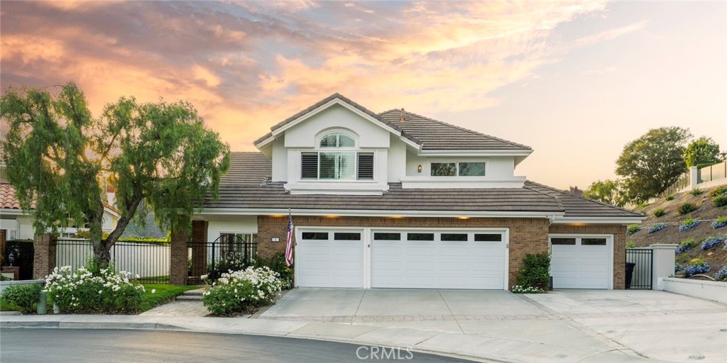Beautifully updated 5-bedroom home with a 4-car garage and expansive grassy yard, set at the end of a single-loaded cul-de-sac in the exclusive, gate-guarded Crest De Ville Estates.
High ceilings, light wood floors, and abundant natural light enhance the entry, living, and dining rooms of this recently remodeled residence. The family room, featuring a stylish fireplace and built-in entertainment center, flows seamlessly into the updated kitchen, where a paneled refrigerator, banquette seating, and 48" Thermador range stand out. Large windows overlook the spacious, flat backyard with sunset views across rolling coastal hills.
The first level also includes a bedroom and bathroom, a generous laundry room, and secondary access to the 4th garage bay, offering additional flexibility.
Upstairs, the primary suite impresses with high ceilings, hillside views, and a well-appointed bath and closet. Two bedrooms share a bathroom, while the fifth bedroom functions as a large bonus room, ideal for entertaining, study space, or media use.
This meticulously maintained home is loaded with premium upgrades, including a PEX repipe, owned solar, new garage doors, new gutters, upgraded windows, built-ins, an updated roof, and more. Move-in ready and turnkey, it offers exceptional comfort and quality.
Crest De Ville is one of South Orange County’s most sought-after gated communities, offering 24-hour guard security, a recently renovated pool, park, and community center. The prime location provides easy access to Dana Point, Laguna Beach, and Laguna Niguel, with renowned restaurants, shopping, world-class golf, luxury resorts, and beaches just minutes away.