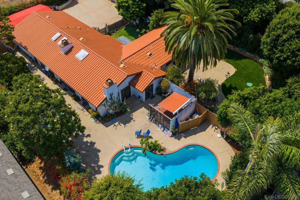 New to the market, this Leucadia retreat sits on a private, oversized lot surrounded by mature trees for a truly secluded setting—just west of I-5. The existing single-level home offers 1,972 sq. ft. with 3 bedrooms, 2 baths, and a flowing open floor plan that includes living, dining, family rooms, and a galley kitchen. Sited West of I-5, walk to beaches and shops plus easy access to freeway. This offering provides plenty of opportunity—expand with a second story, remodel to your taste, or add an ADU. Exterior highlights include a 2-car garage, oversized carport, and ample driveway parking. A sparkling pool framed by citrus trees, multiple patios, and charming outdoor spaces create a tranquil escape while still leaving room for personalization. Ideally located minutes from vibrant Encinitas Village, world-class beaches, top-rated schools, and excellent dining and shopping, this property perfectly blends convenience with Leucadia coastal charm.