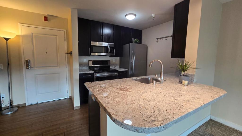 Home is now VA Approved and approved for Conventional Loans! Welcome to this charming 1-bedroom, 1-bathroom home located in the vibrant city of Emeryville. This cozy 743 sq ft residence provides a comfortable living space with a well-appointed kitchen featuring granite countertops, a dishwasher, electric oven, and refrigerator. The kitchen seamlessly flows into the family room, creating a perfect space for entertaining or relaxing. Enjoy your meals at the breakfast bar, and unwind in the living area. The bathroom offers a combined shower and tub for your convenience. The home is equipped with central forced air heating and in-unit laundry with a washer and dryer. This community boasts fantastic amenities, including an in-ground pool, spa/hot tub, and a cabana/dressing room for those sunny days. Additionally, the property includes one fully covered gated garage space, large BBQ area with many tables, huge community room, additional quiet/study room. The large modern gym comes with a sauna and massage room. A live host is available to accept package deliveries. Close to biking trails, Bay Bridge, dog park, playground and walking distance Emeryville Market with some of the best restaurants in the area. Make this delightful Emeryville residence your new home!