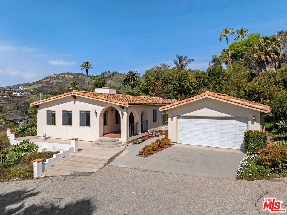 First Time on the Market in 62 years! Nestled in one of Malibu's most sought-after neighborhoods, this charming home offers a perfect blend of classic California style and breathtaking ocean views. Located on a spacious 0.65-acre lot, this property provides the ideal combination of privacy and convenience. It's within a short distance to the beach, allowing you to enjoy the best of coastal living. Additionally, the property offers membership to private tennis courts. Perfect for staying active and socializing in a beautiful setting. This property offers the opportunity to make your visions a reality. The home features an open floor plan filled with natural light, creating a warm and inviting atmosphere. The living area showcases a stunning panoramic ocean and coastal view, offering a serene retreat. The kitchen provides ample cabinet space and dining area making it ideal for those who love to cook and entertain.The outdoor space is just as impressive with sweeping ocean views. This oasis offers plenty of room for a pool, garden, and entertaining area. Situated just minutes from Malibu's renowned shopping, dining, hikes and iconic beaches. This home offers a rare blend of seclusion and accessibility. Whether you are looking for a primary residence or a vacation home, 27104 Sea Vista Drive is a rare opportunity to take this canvas and turn it into your dream home and experience the luxurious Malibu lifestyle. With its unbeatable location, exclusive amenities, and breathtaking views, this home is an absolute must-see!
