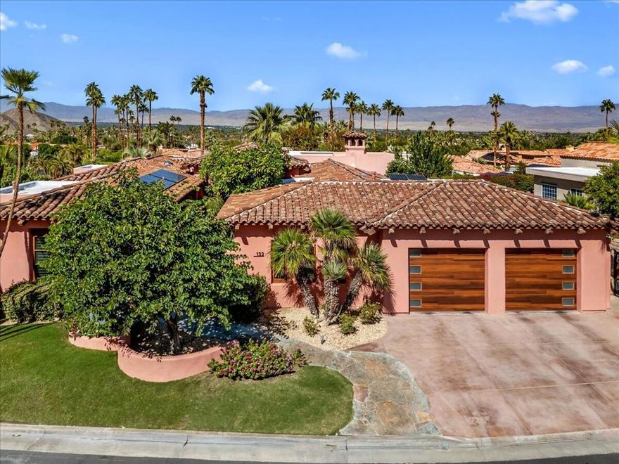 Tucked against a tranquil hillside of Palm Desert, just moments from the shops, dining, and entertainment of El Paseo, this custom-built residence blends artful design with modern luxury. Originally constructed in 2000 by acclaimed novelist and artist John Weston as his private retreat, the home offers a rare balance of privacy, comfort, and sophistication.Recently enhanced by a $300,000 renovation, the property now features a reimagined chef's kitchen, wine pantry, laundry room, garage, and landscaping, along with the transformation of the large fourth bedroom--currently serving as a media room yet easily converted back into an attached casita.Designed for both relaxation and entertaining, the home showcases 10 and 14 foot ceilings, Italian porcelain and wood flooring, and abundant natural light. The saltwater lap pool and spa invite serene outdoor living, complemented by slate patios, outdoor fireplace, tranquil garden fountain, and sweeping mountain, desert and city views.Notable features include an owned solar system, refrigerated and insulated walk-in wine and beverage pantry, whole-house water softener, reverse osmosis filtration, and an air-conditioned garage equipped with two hydraulic car lifts--allowing parking for up to four full-size cars.Each of the four bedrooms offers a private ensuite bath (one with steam shower) individual climate and sound controls, ensuring comfort and privacy for all. Every exterior door is crafted from wood, many as elegant French doors opening to the home's inviting outdoor spaces.Located within the gated community of Vista Paseo on approximately one-third acre of fee-simple land, this home embodies desert living at its most refined--private, artful, and designed to entertain beautifully.Call listing agent for your private showing.
