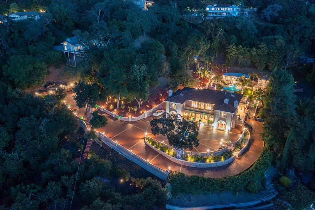 Welcome to an exquisite Mediterranean estate in the foothills of Los Gatos at 16840 Cypress Way. Located at the bottom of Cypress Way, this gated property offers privacy & dramatic views with easy access to the vibrant downtown. This luxurious residence boasts breathtaking vistas of the valley, offering a stunning 5,844sf± of refined living space. Designed for both elegance and comfort, the home features 5 sumptuous bedrooms, each with private ensuite bath, including a convenient main level suite for multi-generational living. The expansive main level is thoughtfully arranged, encompassing a formal living room, spacious office, kitchen/great room, and a formal dining room that opens onto a voluminous covered patio. Perfect for entertainment, this outdoor space overlooks the verdant gardens and enchanting water features. The property spans over 2.03± acres, offering privacy and dramatic views, all within easy reach of vibrant downtown Los Gatos. This gated sanctuary is complemented by a 1,200sf± pool house, jacuzzi pavilion, and sunning terrace, inviting you to indulge in the serene surroundings. Enter through a custom gated entry onto an auto pavilion, accented by a central fountain, setting the stage for a truly luxurious living experience. Award winning Los Gatos Schools!