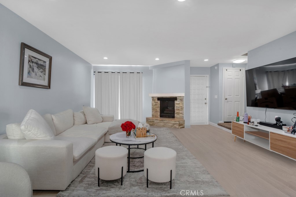 This beautifully updated townhome in a boutique 5-unit complex offers the perfect blend of style, comfort, and convenience with a thoughtful layout. The first floor welcomes you with an open-concept living and dining area featuring elegant laminate flooring, recessed lighting and fireplace. Sliding glass doors open to a private patio—perfect for indoor-outdoor entertaining. The remodeled kitchen is a chef’s dream with shaker-style soft-close cabinets and drawers, quartz countertops, a double sink with modern faucet, and stainless steel appliances including a gas stove, built-in microwave, and dishwasher. A stylish half bath completes the main level, ideal for guests. Upstairs, the spacious primary suite boasts vaulted ceilings, two large double closets, an inviting alcove perfect for a home office or reading nook, and access to the balcony. The full bathroom offers a separate tub and shower, granite-topped vanity, generous cabinetry, and an additional double closet. A full-size stackable washer and dryer and a linen closet are conveniently located just outside the primary suite. Additional features include two assigned tandem gated parking spaces, two storage cabinets, and access to a community patio with BBQ area. HOA dues cover earthquake insurance, water, sewer, and building hot water. Ideally located near the Van Nuys/Sherman Oaks Recreation Center with tennis courts, athletic fields, and a pool. Just minutes from Trader Joe’s, Westfield Fashion Square, and the vibrant restaurants and nightlife of Ventura Blvd—with easy access to the 101 and 405 freeways.This turnkey townhome has it all—style, space, and a location that can’t be beat!