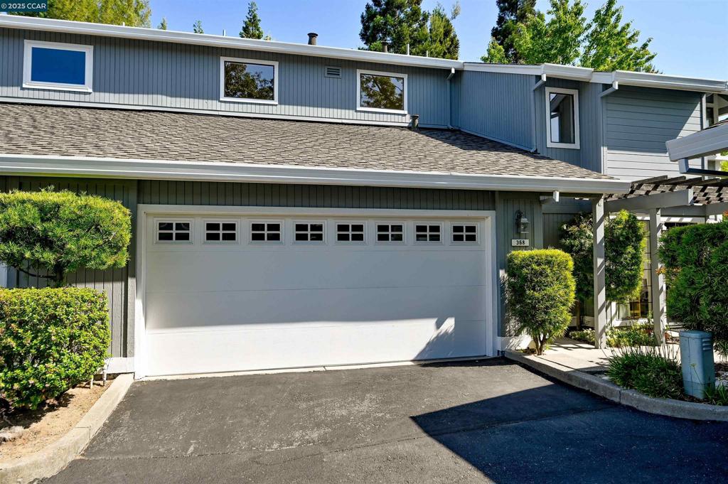 Rare opportunity in a sought-after community where homes rarely become available! This wonderful townhouse offers an open-concept kitchen with a breakfast bar overlooking the inviting living room with a cozy fireplace and adjacent dining area. Both the spacious primary suite and secondary bedroom feature vaulted ceilings and private balcony access. A private patio off the living room provides the perfect space to relax or entertain. Additional highlights include an attached two-car garage with laundry area and utility sink, ample storage, dual pane windows, central heat and air, and stylish plantation shutters. Ideally located near scenic trails, schools, shopping, and freeway access.