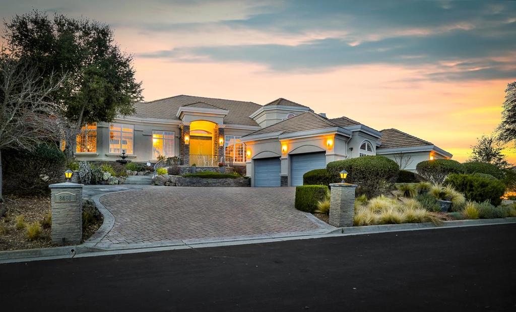 Nestled in Gilroy's most exclusive private gated community this stunning estate blends luxury and tranquility. This remarkable home features 4 spacious bedrooms, offering unparalleled comfort and privacy. With approx 5,400 sq ft of space on a half-acre lot showcasing exquisite craftsmanship, including soaring 16-foot ceilings ,10-inch crown moldings and a Japanese-inspired room that accentuate its elegance. Step into the gracious living room, where cherry hardwood floors, a magnificent crystal chandelier, and custom double-pane windows create an inviting atmosphere. A dedicated game room offers a cozy retreat with Brazilian cherry wood floors, custom cherry cabinetry, and faux textured walls. For the ultimate entertainment experience, the state-of-the-art home theater is equipped with a movie projector, 1000W power amplifier, and TDK century-style speakers, ensuring a cinematic experience. Retreat to the primary suite, where a private fireplace, spa-like en-suite bath, and built-in massage system create the perfect sanctuary. Step outside to your backyard oasis offering a stunning 16-foot waterfall, Pebble Tec pool and spa, complete with swim jets. Home includes a 4-car garage and can easily accommodate 8 cars in the driveway. Don't miss this opportunity!