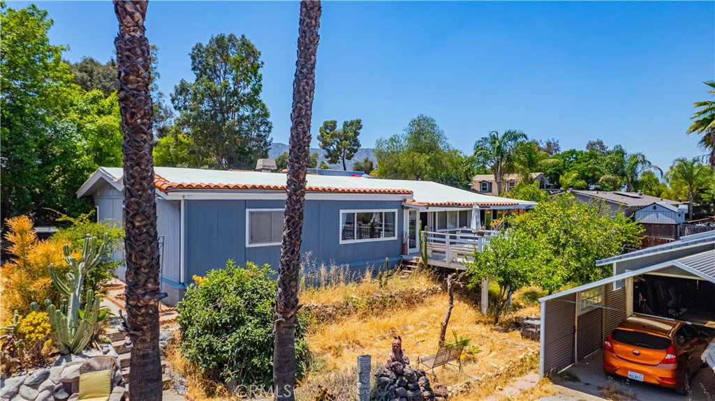 Discover the perfect blend of country charm and usable space. This 3-bedroom, 2-bathroom, triple-wide manufactured home, offers approximately 2160 sq. ft. of comfortable living space on nearly half an acre of flat, usable land—zoned for horses, brand new A/C, newer windows and ideal for outdoor living, RV parking, or future additions. Inside, enjoy a spacious layout with a cozy fireplace, natural light, and a functional flow perfect for everyday living or entertaining. Located in a peaceful neighborhood with easy access to shopping, schools, and major roadways, this property is a rare opportunity to enjoy rural living with city convenience.
