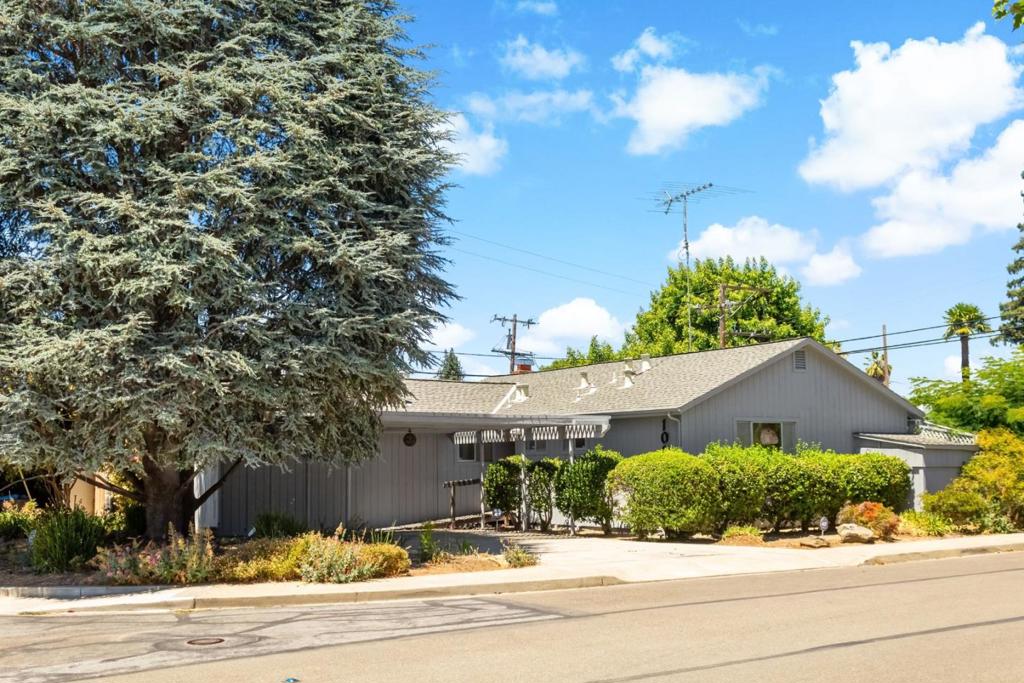 Fantastic fixer opportunity on a large corner lot tucked away in a serene area in beautiful Old Mountain View, 2 blocks from Landels Elementary School. This spacious 2 bed & 2 bath home (with 2 of its original 3 bedrooms converted to a single large primary bedroom) in a coveted neighborhood invites you to put your stamp on it. New interior paint and refinished hardwood floors! Garage has been converted to a family room/den/studio whatever you would like it to be - and its approx 377 square feet is not included in the approx 1,124 square feet shown in the public records. Beautiful pool too! Only one owner. Close to Stevens Creek Trail, Mountain View City Center and the wonderful shopping and dining on Castro Street in Downtown Mountain View. This home has tons of potential and an outstanding location!