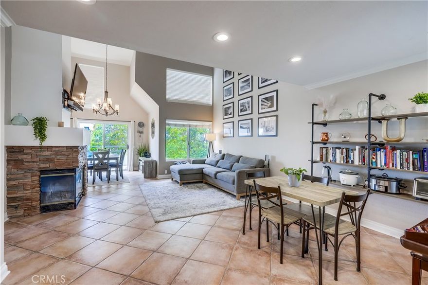 Gorgeous turnkey upper-level home superbly located perched hilltop with spectacular city lights and hills views from the private balcony. Desirable Hillcrest Village community centrally located in Mission Viejo within walking distance of Mission Viejo Medical Center/Hospital, The Shops at Mission Viejo, and Saddleback College. Step inside and soak in the light filled open concept living space, soaring two story ceilings, crown molding, custom light fixtures, a beautiful, stacked stone fireplace, and gorgeous sit-down views, all setting the stage for a superb living space. The formal dining area has sliders opening to the private view balcony creating an ideal indoor-outdoor living space. The light and bright kitchen has timeless white shaker cabinetry, Quartz countertops, updated fixtures and faucet, stainless steel appliances, and a convenient laundry closet with stackable washer and dryer included. The main level is blessed with an updated full bathroom boasting custom sink and faucet, custom lighting, and a beautifully updated shower and tub with marble tile surround and upgraded shower fixtures. The spacious primary bedroom on the main level has a walk-in closet and takes full advantage of the amazing views with direct access to the private balcony, the perfect place for enjoying sunsets and an evening glass of wine with a loved one. Travel upstairs to the large loft, perfect for a home office and also blessed with amazing hills views and an ensuite bathroom with subway tile, updated vanity and sink, and updated fixtures. This home includes a 1 car detached garage with overhead storage shelving and 1 uncovered parking space. Well maintained community amenities include sparkling community pool and spa, picnic areas, and lounging areas. Lake Mission Viejo membership included. Close to an abundance of shopping, dining, entertainment, hiking and biking trails throughout O’Neill Regional Park and Arroyo Trabuco Trail, easy 5 freeway access, and just minutes to local beaches.