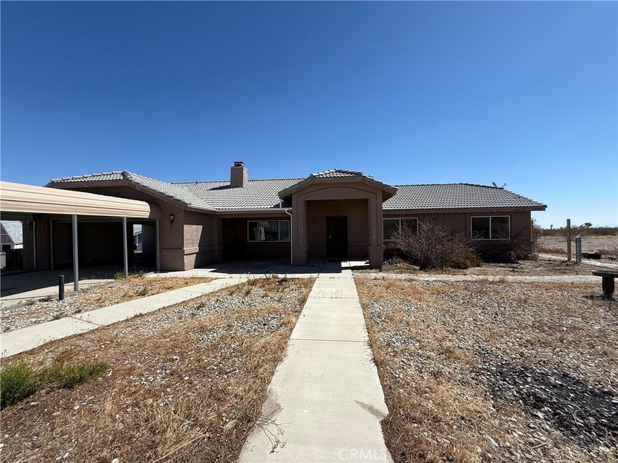 Discover the comfort and privacy of this nice 4 bedroom, 2 bath home situated on a desirable corner lot. Offering over a half acre of fully fenced in property, this residence provided plenty of space, privacy and versatility for everyday living. Step inside and find laminate flooring throughout, good sized bedrooms, master bedroom with private bathroom.  Kitchen has plenty of cabinet space.  Quick drive off main road on a relatively smooth dirt road. The home features a large driveway, carport, and storage shed.
