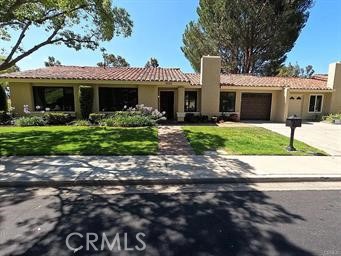 A Rare Gem in Casta Del Sol — Say Goodbye to Cookie-Cutter Homes! Tired of the same white-and-gray flips? Discover a truly unique retreat nestled among the majestic pines in the highly sought-after 55+ gated community of Casta Del Sol. This warm, wood-accented home stands out from the crowd — so much character, if there were bears even the bears would stop to admire it! Prime Location: Situated on the highest elevated lot on a quiet, secluded corner, this home offers rare privacy surrounded by mature trees and lush greenbelt views. Enjoy peace of mind with 24-hour gated security, while the HOA maintains the pristine grounds. Luxury Renovation with No Expense Spared: Crafted with artisan precision, this is no ordinary remodel. This is not a flip. This is a lovingly transformed work of art in one of the most prestigious gated communities around. Every detail has been thoughtfully curated by professional tradesmen using only high-end materials. Vaulted ceilings, recessed LED lighting, and rich crown mouldings set the tone, while 19 genuine Brazilian Mahogany doors elevate the space with timeless elegance. Chef’s Kitchen & Open Living: The completely redesigned kitchen features extensive custom stained oak cabinetry, a center island, and a stylish bar for extra seating. Quartz countertops, a striking backsplash, and top-tier stainless steel appliances — including a commercial-grade sink — complete the space. The open floor plan flows seamlessly into a spacious living and dining area with a cozy, newly refreshed fireplace and access to the custom paver patio with Alumawood cover — perfect for indoor-outdoor living. Premium Features Throughout: •Pella fiberglass windows and sliders with elegant picture-frame mouldings . •Six Normandy wood shutters by Norman . •Durable pattern tile flooring with ½-inch rubber padding for comfort . •SmartKey locks for secure, easy rekeying . •QuietCool whole-house fan for added energy efficiency. Retreat-Style Bedrooms & Baths: The master suite offers a walk-in tile shower, stained oak vanity, and quartz countertop. All three bedrooms include ceiling fans, upgraded closets, and stunning mahogany doors. The second bath features a new tub, updated tile, and stylish finishes throughout. Even the extra-deep one-car garage is upgraded with tile flooring and a dedicated laundry area.