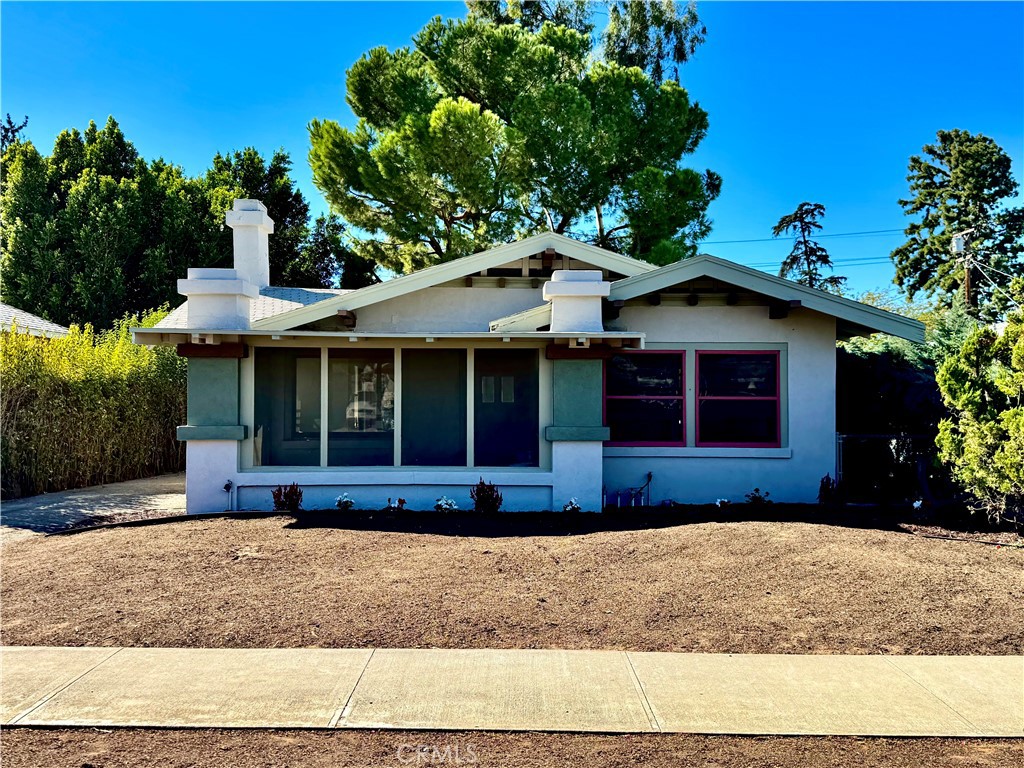 Discover this charming and meticulously reimagined Craftsman home in Riverside. This 4-bedroom, 2-bath residence blends classic appeal with modern elegance, showcasing a beautifully updated kitchen featuring quartz countertops, a stylish herringbone subway tile backsplash, and a charming farmhouse sink. The home preserves its historic character with original single-hung wood windows with cylinder glass that flood the space with natural light and a coved ceiling through out the home. A spacious family room centers around an original fireplace, creating a cozy retreat for winter evenings. Enhanced with modern electrical systems, central heating and air for year round comfort, and a convenient laundry room, this home balances space, comfort and functionality. An expansive, usable basement offers additional versatility. Ideally located in the heart of Riverside, this property is just minutes from California Baptist University, UC Riverside, and the vibrant downtown area, home to the iconic Riverside Mission Inn.