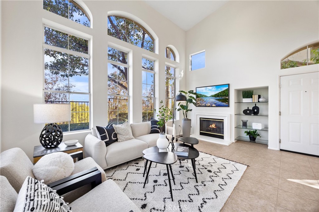 Welcome to your dream home in the beautiful community of Tierra Montanosa. This stunning three-bedroom, three-bathroom condominium offers panoramic views of the city lights, valley
and Saddleback mountains, creating a serene backdrop for your everyday life.
As you step inside, you'll be captivated by the soaring cathedral ceilings and abundant natural light streaming through the floor-to-ceiling windows. The open-concept layout is perfect for both relaxation and entertaining. One of the highlights of this home is the convenient full bedroom and bathroom located downstairs with slider to patio, ideal for guests or family members. Upstairs you will find dual-masters. One with walk in closet, the other with 2 closets and incredible panoramic views!
The remodeled kitchen features gorgeous hardwood cabinetry and modern finishes. This home comes equipped with essential appliances, including a washer, dryer, and refrigerator, along with new paint and carpet throughout for a fresh, modern feel.
Enjoy the luxury of a two-car attached garage with a Tesla charging system, making life easier for eco-conscious residents.
The wonderful amenities in Rancho Santa Margarita include six swimming pools, spa, various sports courts, parks, scenic hiking trails, and exclusive access to Rancho Santa Margarita Lake and Beach Club.
This community is recognized as the safest city in California for the second consecutive year. Additionally, you’re just a short distance from the highly-acclaimed Melinda Heights Elementary School.
Don’t miss your opportunity to own this spectacular condominium in a vibrant community! Schedule your viewing today and experience all that Rancho Santa Margarita has to offer.