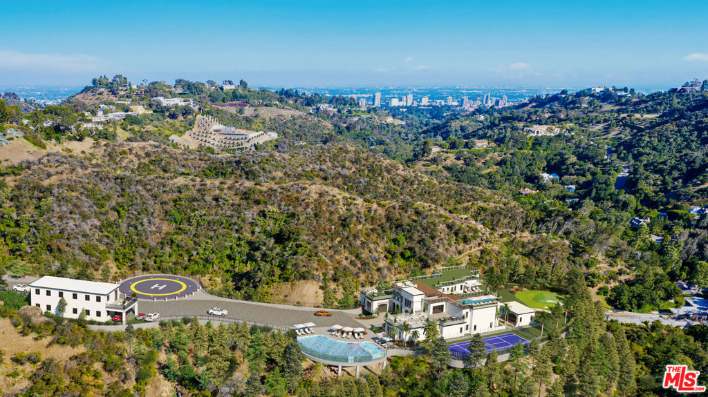 Project 1951...An almost 5 acre development site in prime Bel Air, offering a rare opportunity to build a single-family compound on this private mountain top. The property has undergone extensive infrastructure improvements with caissons and retaining walls already in place. The iconic hilltop property hovers high above the city, offering unobstructed views in this world class location. This developer's dream has unlimited potential. Situated amongst celebrity estates and just moments away from the iconic Bel Air Hotel, this is truly a once-in-a-lifetime opportunity that will never be seen again.
