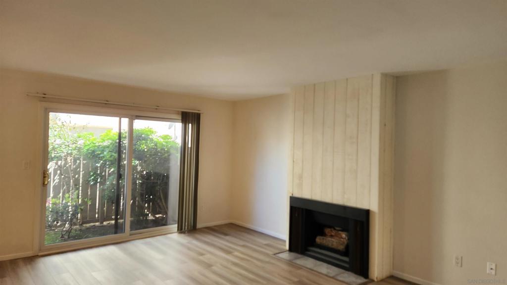 Highly updated cozy condo located in the City of San Diego neighborhood of Pacific Beach (PB). Located right off of Grand Avenue across the street from Mission Bay High School. The location provides close proximity & enjoyment of the attractions to PB without the hassle of traffic. Easy freeway access. Private patio & 2 assigned parking spaces: one covered & the one uncovered. Exterior storage located at the covered parking spot. Dual pane windows throughout & sliding glass door; very quiet when all are closed. Brand new luxury vinyl flooring installed in living room of March 2023. Fully functioning gas fireplace. Kitchen & bathroom boasts easy close drawers & cabinet doors as well as new GFCI's installed. Updated kitchen appliances. Plenty of interior closet space. Community laundry room with 3 washers & 3 dryers (Coin or App operated). Below ground pool and jacuzzi. Very quiet complex. Come see this PB Pearl before it’s picked up!
