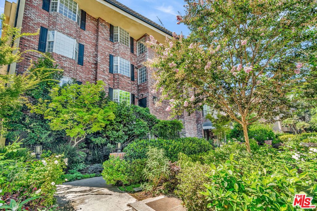 Exceptional condo overlooking beautiful tree-lined street in the heart of Sherman Oaks, South of Ventura Blvd. Recently renovated with modern finishes, this spacious single-level home blends style, function, and comfort. A welcoming entry leads into a light-filled step-down living room with recessed lighting and fireplace. The open layout flows to a dining area and a beautifully remodeled kitchen featuring quartz countertops, glazed ceramic backsplash, custom soft-close cabinetry, mixer lift system, Cafe appliances, and a workstation sink. The generously sized primary suite boasts two custom-designed walk-in closets with European-style cabinetry and soft-close doors and drawers, along with an updated ensuite bath showcasing dual vanities, custom tile shower, and Delta fixtures. The secondary bedroom offers a large closet and easy access to a stylishly upgraded full bath. An in-unit LG WashTower provides added convenience. Additional highlights include: LVP flooring throughout, central HVAC, side-by-side parking with storage in a gated garage, Tesla EV charger, and community amenities including a pool, spa, and gym. Located close to shopping, theaters, easy freeway access, dining, and so much more (Bacari, Schatzi's, Local Peasant, Mendocino Farms, and Ralphs all about a block away)! An amazing property that is ready to be your new home.