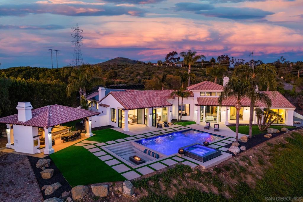 Enjoy incredible sweeping panoramic south-westerly views over Rancho Santa Fe. One of only 22 homes in the gated community of The Summit at Rancho Santa Fe. A beautifully renovated modern masterpiece, single level home that has it all. Complete with custom upgrades, this elegant estate features all new panoramic windows throughout. The open floor plan show cases the exquisite living room with a 22 foot floor to ceiling height that leads to the fully remodeled Chef's kitchen with a spacious double island, quartz countertops, modern cabinetry w/Blum hardware and top of the line Miele appliances. Stunning movie theatre w/incredible surround sound. The five en-suite bedrooms are fully customized w/new solid wood doors custom closets throughout. Sparkling pool and spa with fountain features, outdoor living with a covered pavilion with BBQ, full kitchen and bar, Incredible lush property with numerous fruit trees and an amazing sport court for basketball or set up your own pickleball court. This is a stunning property with so much more to mention. Enjoy incredible sweeping panoramic south-westerly views over Rancho Santa Fe. One of only 22 homes in the gated community of The Summit at Rancho Santa Fe. A beautifully renovated modern masterpiece, single level home that has it all. Complete with custom upgrades, this elegant estate features all new panoramic windows throughout. The open floor plan show cases the exquisite living room with a 22 foot floor to ceiling height that leads to the fully remodeled Chef's kitchen with a spacious double island, quartz countertops, modern cabinetry w/Blum hardware and top of the line Miele appliances. Stunning movie theatre w/incredible surround sound. The five en-suite bedrooms are fully customized w/new solid wood doors custom closets throughout. Sparkling pool and spa with fountain features, outdoor living with a covered pavilion with BBQ, full kitchen and bar, Incredible lush property with numerous fruit trees and an amazing sport court for basketball or set up your own pickleball court. This is a stunning property with so much more to mention.
