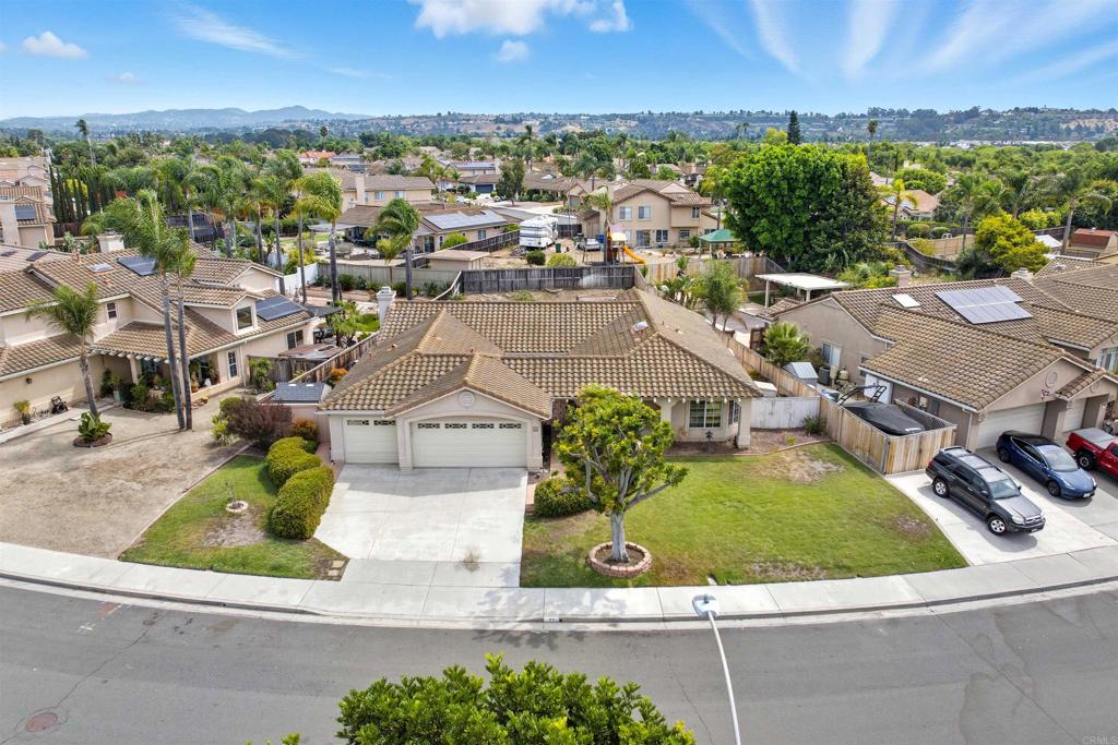 Discover this rarely available single-story home situated on a 10,000+ sq-ft lot. Located on a peaceful tree-lined street in the highly desirable Rancho Pacifica neighborhood with no HOA, this popular floor plan offers maximum flexibility and epitomizes Southern California indoor-outdoor living. Inside, the optional 5th bedroom is currently configured as a bonus room connected to the primary suite—ideal for a home office, nursery, or sitting room, or easily converted into a true 5th bedroom. The spacious primary suite features private access to a covered patio, a large walk-in closet, and a bath with soaking tub and separate shower. The open, sun-filled floor plan includes multiple living and dining areas, abundant windows, and seamless access to a second covered patio off the family room. The expansive fenced backyard provides privacy, plenty of room for entertaining, and ample space to add a pool. Additional upgrades include whole-house re-plumbing with raised pipes for peace of mind. Located about 5 miles from the coast in the El Camino HS district, you’re only 10–15 minutes from the iconic Oceanside Harbor, historic pier, trendy downtown district with award-winning restaurants, and stunning beaches. This home is attractively priced to allow the next owner to personalize with their own cosmetic updates—making it an incredible value in one of Oceanside’s most sought-after neighborhoods.