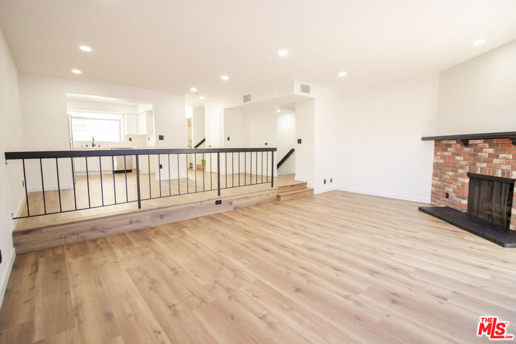 Introducing a stunning and spacious 2-bedroom, 2.5-bathroom townhome located in the heart of Santa Monica. This beautifully updated home features an open and airy floor plan. As you enter the unit, you'll be greeted by a light-filled living room complete with a fireplace, and a large sliding glass door that leads to a private balcony. The modern kitchen boasts stainless steel appliances, sleek countertops, and ample cabinet space for all your storage needs. The primary bedroom offers a tranquil retreat with a fireplace, vaulted ceilings, an en-suite bathroom, a large closet, and plenty of natural light. The second bedroom is equally spacious and features its own en suite bathroom. Additional features of this incredible home include a laundry closet with washer and dryer hookups, a two-car private attached garage, and a convenient location just minutes from world-class shopping, dining, and entertainment.
