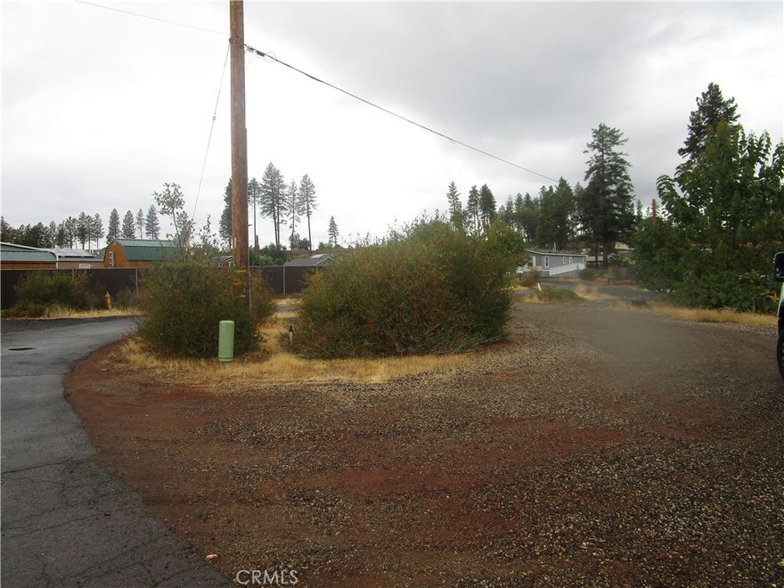 .57 acre lot with Circle driveway. Convenient access to Save Mart Shopping Center, Drug store, Post Office and Dining. Unknown status of septic. Buyer to investigate all to their satisfaction. Seller is paying PID.