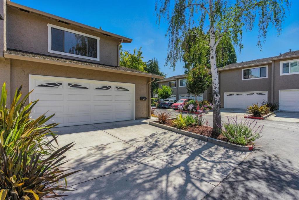 Welcome to this beautifully updated 2-bedroom, 2-bath townhome in the desirable Casa Del Valle community. This bright and airy end-unit offers a spacious layout with fresh paint, new carpet, and stylish modern fixtures throughout. The inviting living room features a cozy fireplace, and the kitchen boasts a convenient pass-through serving window, updated cabinet pulls, and a seamless connection to the dining area, perfect for entertaining. Enjoy year-round comfort with central A/C. Step outside to a generous private patio ideal for relaxing or outdoor dining. Upstairs, you'll find two oversized bedrooms, including a primary suite with a walk-in closet and en-suite bath. Additional highlights include an attached two-car garage with in-unit laundry. The well-maintained community features a sparkling pool and spa. Conveniently located near major freeways, shopping centers, and tech campuses, this turnkey home blends comfort, style, and accessibility.