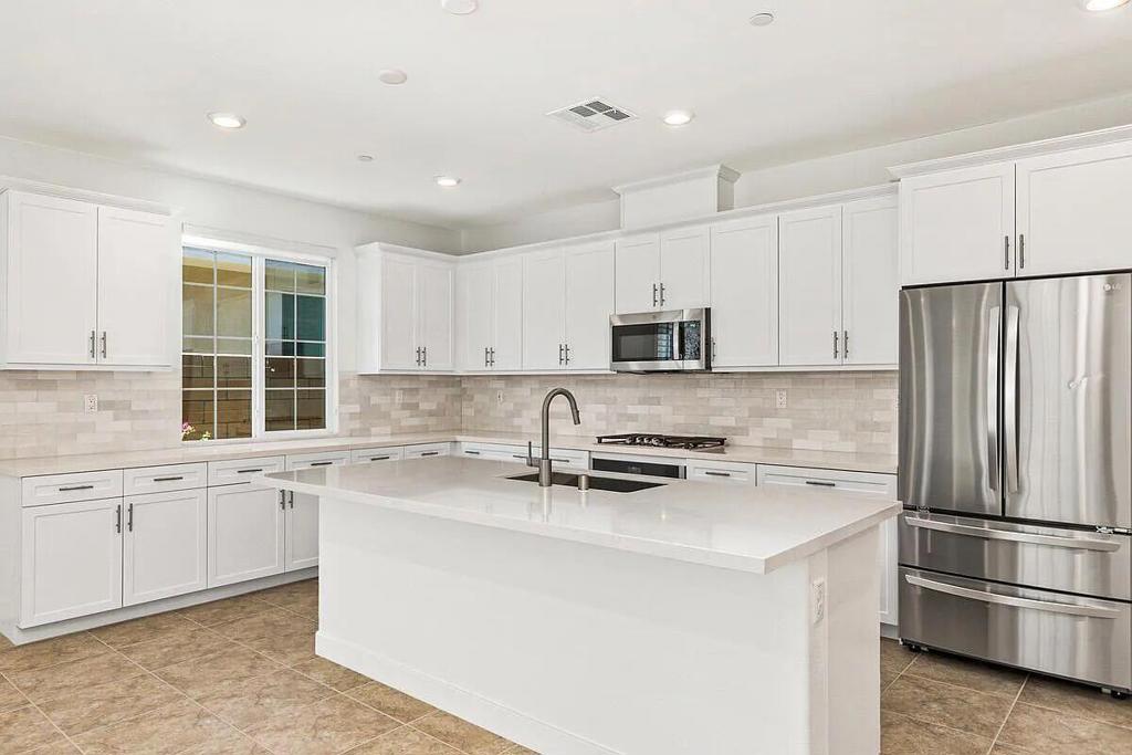 Available July 15, 2025 - Long-Term Lease Contact James Guillermo at (760) 449-1345 to schedule a private showing (48-hour notice required) This stunning, like-new home in the desirable Dolce community was completed in 2023 and is packed with premium features for comfort, style, and convenience. Unfurnished and solar-powered, this 4-bedroom, 2-bath residence offers a spacious layout perfect for modern living. Property Features:Bright, open floor plan with abundant natural lightStylish kitchen with:Stainless steel appliancesGas cooktopCenter island for meal prep or casual diningSpacious great room - ideal for entertainingPrivate backyard with outdoor potentialSplit floor plan for privacyPrimary suite with:Walk-in closetSoaking tub & walk-in showerDual vanitiesDirect access to the backyardSmart Home Technology:Ring security systemHard-wired security camerasUpgraded Moen fixtures throughoutLike-new washer and dryer includedAttached 2-car garage🏘 Community Amenities:Intimate 73-home communityCommunity swimming poolRecreation area with green space📜 Lease Terms:Rent includes:LandscapingHOA feesTrash pickupTenant responsible for:WaterGasWiFiSolar power fee: $120/month