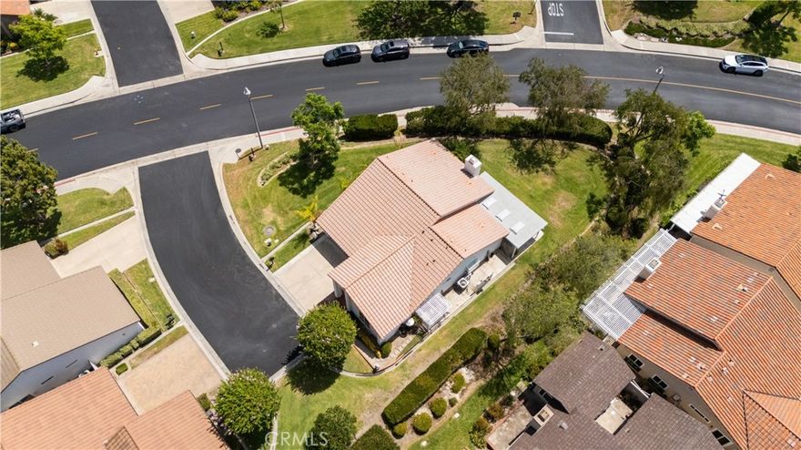 Experience the epitome of 55+ gated living in this stunning, completely remodeled ranch-style home, ideally located on a quiet cul-de-sac in Mission Viejo’s desirable Casta Del Sol community. This nearly 1,500 sq. ft. residence offers three bedrooms and two bathrooms, with a unique private setting and no direct neighbors to both sides or behind. The home has been meticulously upgraded throughout. The designer gourmet kitchen is a showstopper, featuring a quartz island, Italian porcelain countertops, new cabinetry, a pot filler, drawer microwave, matching stainless steel appliances, and a walk-in pantry. Bi-fold glass doors frame lush greenbelt views and create seamless indoor–outdoor living, opening to a spacious entertainer’s backyard with a covered patio and skylights. The thousands spent on this recent remodel will not disappoint! The primary suite impresses with vaulted ceilings, recessed lighting, and a thoughtfully designed walk-in closet. The spa-style bath boasts dual sinks, Quartz counters, and a large walk-in shower with dual shower heads. Two secondary bedrooms and a fully remodeled bath with marble countertop complete the home. Additional highlights include new flooring, paint, double-pane windows, electronic blinds, a new hot water heater, nearly new HVAC, and a complete repipe. An attached two-car garage offers pull-down attic storage. The property also benefits from low taxes, no Mello Roos, and full membership to Lake Mission Viejo for fishing, boating, concerts, and more. Residents enjoy the many amenities of Casta Del Sol, including two recreation centers with pools, spas, tennis and pickleball courts, gym, hiking trails, shuffleboard, billiards, and more. This move-in ready home is a rare find—better hurry on this one!