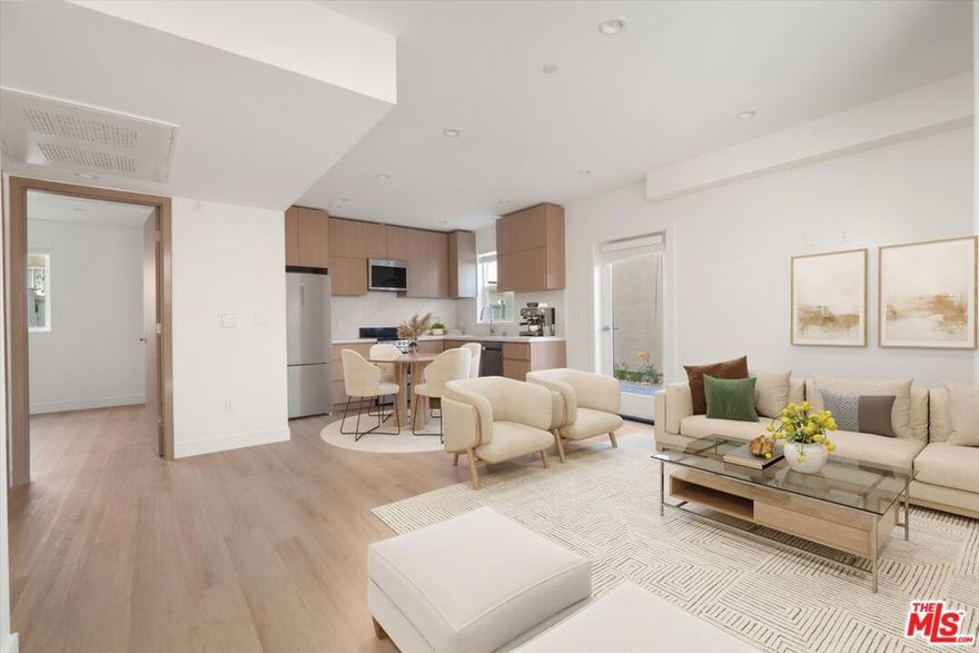 Modern ADU with Private Patio in Prime Sherman Oaks! Discover this stylish 2-bed, 2-bath JADU designed for modern living. Step into an open-concept kitchen and living area featuring brand-new stainless steel appliances, quartz countertops, vinyl plank flooring and abundant natural light throughout. The primary suite offers a comfortable retreat with an en-suite bathroom, while the guest bedroom is conveniently located next to a full bath and in-unit stackable laundry. Enjoy your own private, enclosed patio  perfect for outdoor dining or weekend grilling. Just moments from the Sherman Oaks Galleria, Regal Theatres, Whole Foods, and easy access to the 405, this home delivers modern comfort in one of LA's most convenient locations.