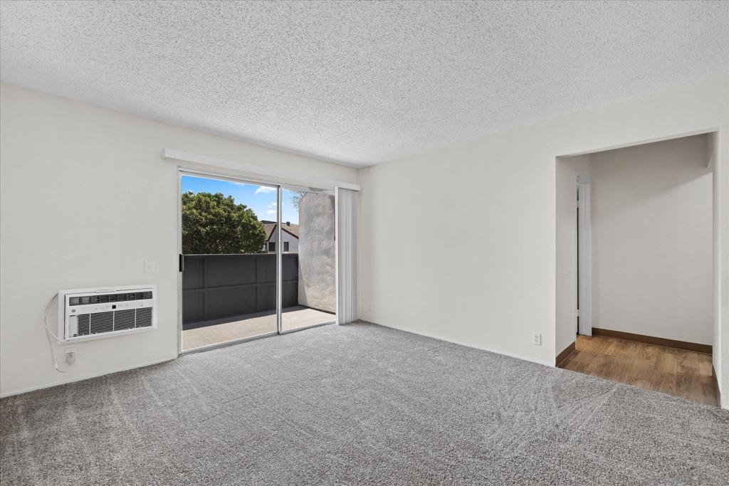 Welcome to your bright retreat in the heart of San Diego! Tucked inside a quiet community, this desirable second-floor condo combines comfort, convenience, and style. Step inside to find a large living/sleeping space filled with natural light, a cozy dining area, and a spacious bathroom and closet for added functionality. Recent updates—including fresh carpet, newer cabinetry, vanity, appliances, wall AC unit, and refinished tub—bring a refreshed feel throughout. A private patio extends your living space outdoors, perfect for morning coffee or evening unwinding. Resort-style amenities await just outside your door: take a dip in the sparkling pool, soak in the spa, host a weekend BBQ, or take advantage of the community laundry facilities. With your own assigned parking spot and quick access to the trolley, Fashion Valley, and the scenic San Diego River, everyday living feels effortless. Whether you’re looking for your first home or a stylish city escape, this condo offers the perfect blend of location, lifestyle, and value.