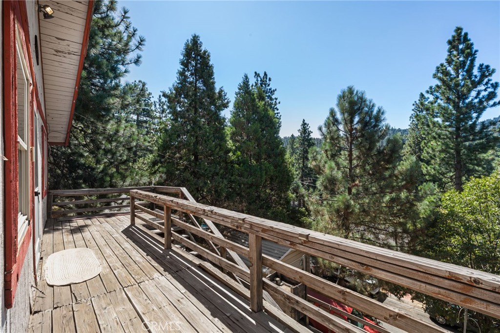 This charming mountain home offers a perfect opportunity to create your own private retreat. Offering 866 square feet of living space, the property features a versatile layout with two bedrooms and 1.5 bathrooms on the main level, plus an additional bedroom and half bath in the basement, ideal for guests, a home office, or extra storage. This home invites creativity and vision for updates and personal enhancements. Whether you're searching for a weekend getaway, a full-time residence, or an investment opportunity, this property offers the potential to craft a peaceful, welcoming space to call your own. With a little care and imagination, it’s ready to be transformed into something truly special.