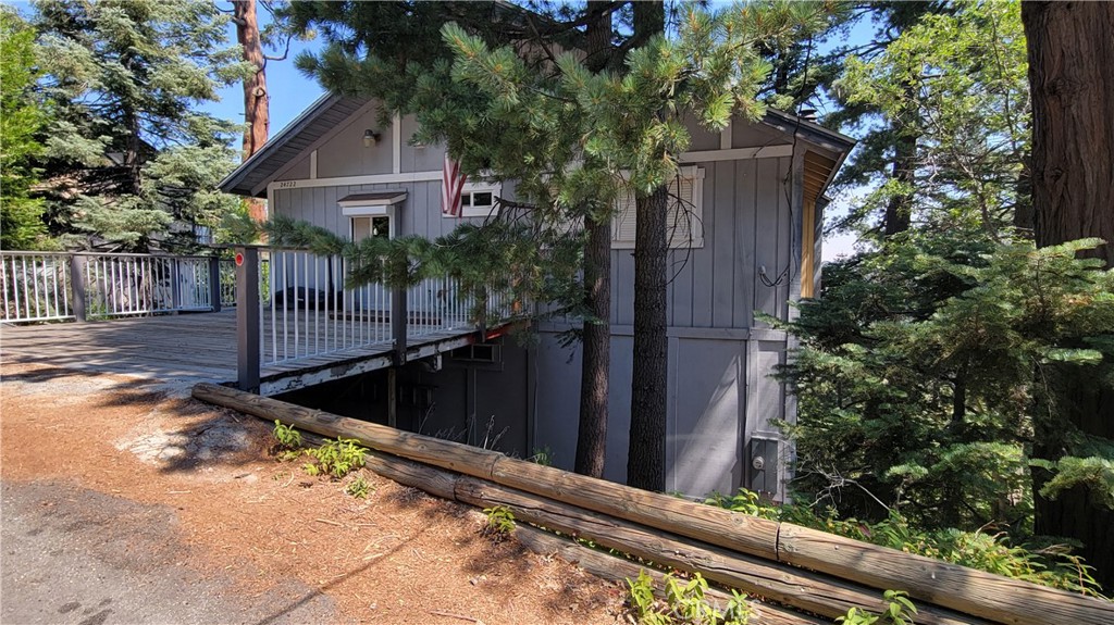 Check out this spectacular VIEW home in Crestline! Conveniently located to commute down the hill, run a quick trip into town or take the family to the lake for a bit. You'll be so happy to call this spot yours! Level parking and level entry make access to this home a breeze. Main level features an updated kitchen, dining area, living room, bedroom and full bathroom. You'll love the vaulted ceilings, which help showcase the beautiful fireplace, and dual access to the deck. The views from this area are to die for!
Head downstairs to the family room, laundry room and two guest bedrooms. There's also a full bathroom on this floor AND another deck.
Down one more level is a bonus room, bedroom or den and the third beautiful bathroom.
There's space for all your friends and family to enjoy the mountains at 24722 Bernard. The family that is selling has enjoyed many years of respite here and now it's time to make it your own. Add this great home to your next tour!