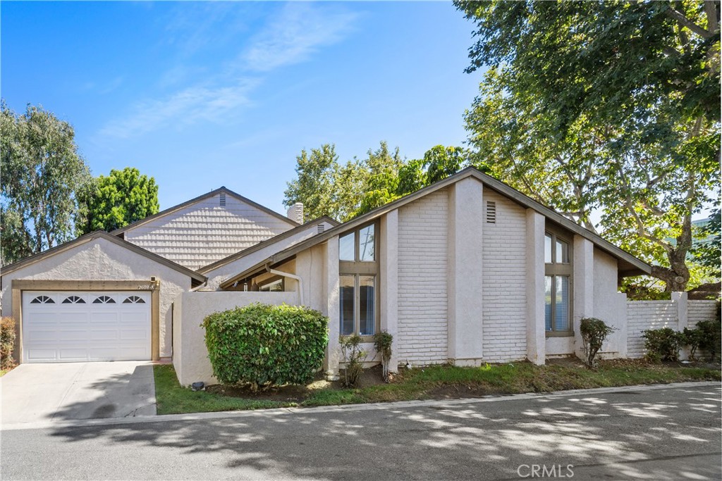 Located in the quiet, Shady Hollow community of North Tustin, this beautiful, recently upgraded one-story condo is a corner unit (attached on only one side) with 2-car attached garage, large backyard, plus a spacious and cozy front courtyard. This is a fantastic opportunity to get a property of this quality at an incredibly low purchase price. The tall, vaulted ceilings, new wood floors and fireplace give this home a warm, cozy feeling with plenty of light beaming in through the many windows. Recently upgraded in January — new wood floors throughout, freshly painted interior, in the kitchen is new tile backsplash all around the cooking and sink area, farmhouse sink and butcher block countertops, new soft-close cabinetry and microwave. Fixtures and doorknobs throughout the home are also new. Both bathrooms were upgraded in 2019. Ceilings are insulated with 6” fiberglass, helping keep inside temperatures comfortable and lowering cooling costs. 3-ton, high efficiency A/C unit, rain gutters, ADT alarm system, ceiling fans, recessed lighting, lots of closet space with built-ins and a gas fireplace. The garage has custom overhead storage and laundry. ***SHADY HOLLOW IS A LAND LEASE COMMUNITY*** Contact listing agent for details.