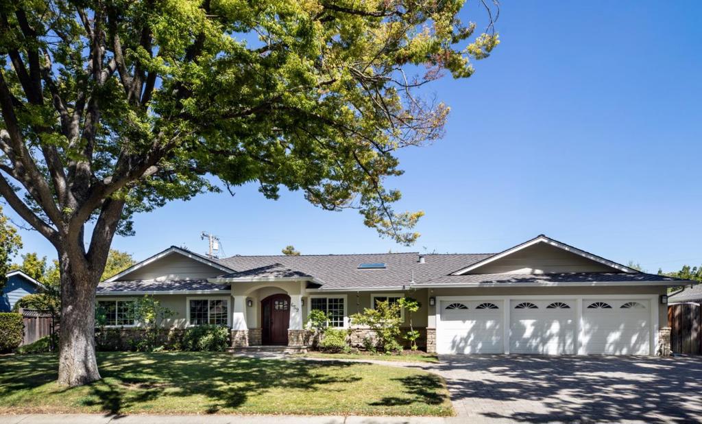 Turnkey Craftsman just one mile from the Village! This beautifully updated single-level home offers 4 bedrooms, 2 baths, fresh paint, and teak floors throughout. Formal living and dining rooms open to the rear yard, while the stunning kitchen boasts white cabinetry, black granite counters, subway tile, skylit island seating, and a breakfast nook. The family room with fireplace adds comfort and easy indoor-outdoor flow. The primary suite features a cathedral ceiling, skylight, custom closets, French doors, and a spa-inspired bath. Outdoors, enjoy a bluestone patio, arbor-covered barbecue center, fruit trees, and professional landscaping on a 10,000 sq ft lot. A rare 3-car garage adds flexibility. All this on one of Los Altos most beautiful tree-lined streets with access to top-rated schools: Santa Rita Elementary, Egan Jr High School, and Los Altos High.