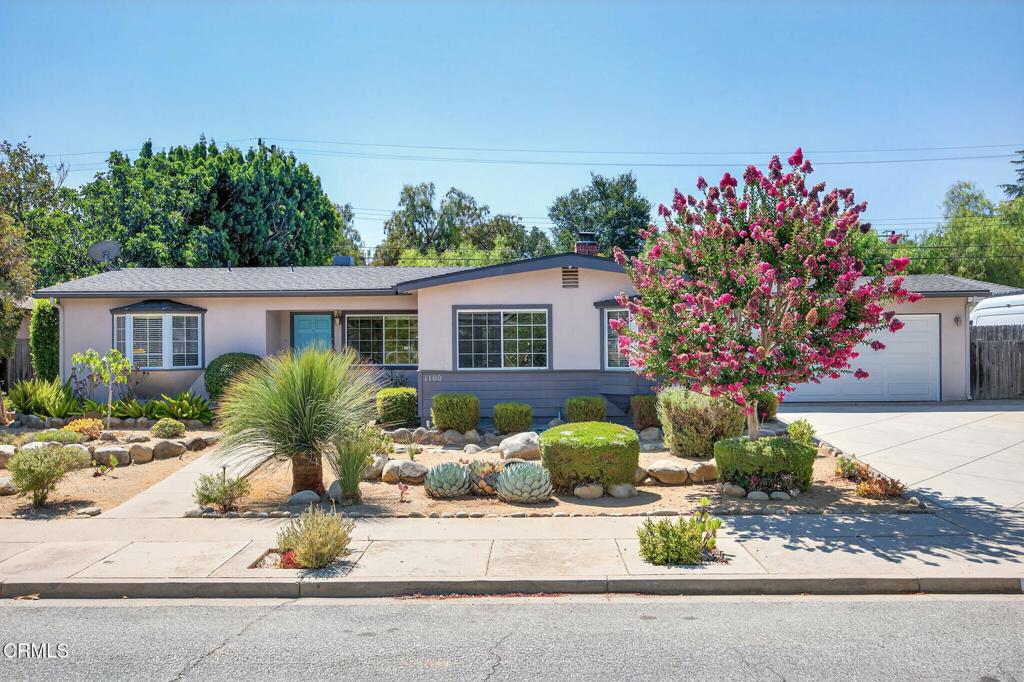 With an ideal location equidistant to the charms of Ojai and the beaches in Ventura, this single level, three bedroom, two bath home has been beautifully maintained and smartly updated to include the aesthetics of a newer kitchen and tiled bath, easy-care engineered hardwood and tile flooring, recessed lighting, newer HVAC systems, water heater and more. With bright natural light, rich choices in wall colors, river-rock fireplaces in both living room and primary bedroom, and a family room with views that keep you connected to the rear yard, this home couldn't be more inviting! Enjoy the privacy of the rear yard where the expansive pavered patio surrounds a sparkling pool and hot tub. The large, covered patio is great for entertaining.