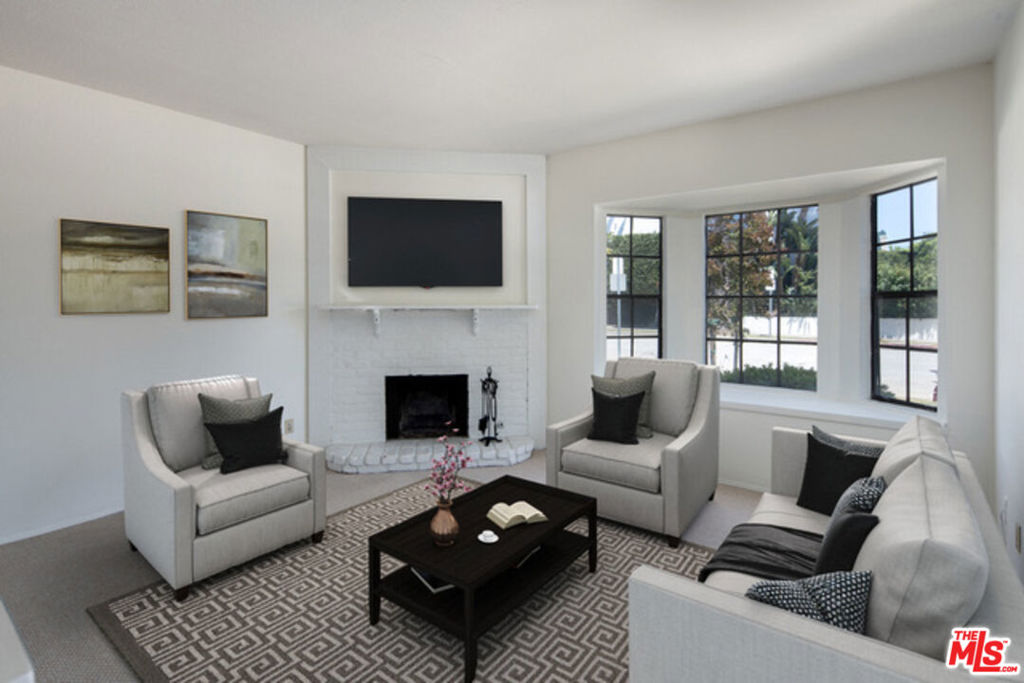 Located in the heart of prime West LA, this south-facing two-story townhouse sits in a highly sought-after neighborhood with an impressive Walk Score of 91. Featuring 2 bedrooms, 2.5 bathrooms, and a dedicated office space, the home boasts a light-filled, open-concept floor plan with beautiful hardwood floors throughout. The spacious family room with fireplace flows seamlessly into the dining area, perfect for both entertaining and everyday living. The kitchen offers a dine-in breakfast bar, generous pantry, ample cabinetry, and private in-unit laundry. Upstairs, both bedrooms and bathrooms provide comfort and functionality, along with a versatile office space. The unit includes two assigned parking spots and is just moments from the vibrant dining, shopping, and nightlife of Sawtelle Boulevard.