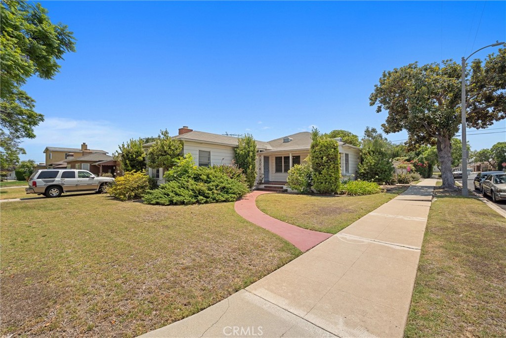 Step into nearly 1,900 sq. ft. of timeless character in this 3-bedroom, 2-bath home, nestled on an expansive 8,000+ sq. ft. lot with a 2-car garage. From the moment you enter, you’ll feel the warmth of old-school charm—formal dining and living rooms, built-in shelving, and original features. Unique features like a bedroom with a Dutch door to a bar, a private dressing room in the primary suite (they don’t make them like this anymore!), and an additional bedroom suite set this home apart. Inside laundry, generous storage, and thoughtful floorplan design add to its appeal. The home needs some TLC—but with its spacious footprint, vintage details, and large lot, the possibilities are endless.