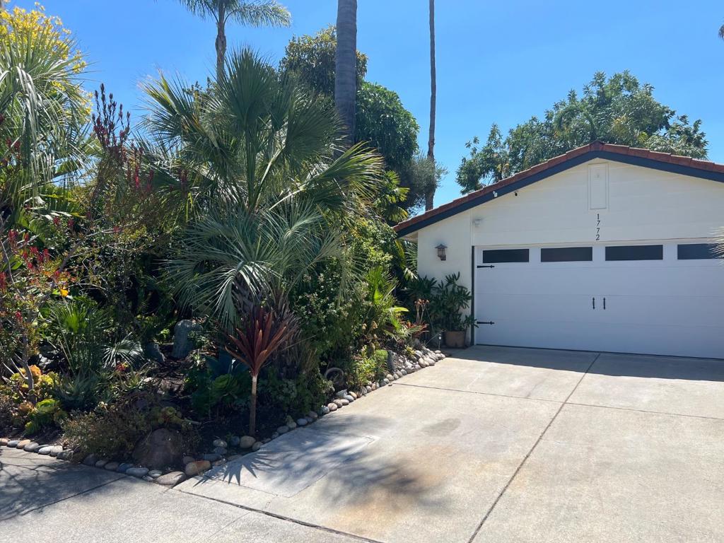Lush tropical garden greets you to this nicely updated 3 bedrooms 2 updated bath single story home. Newly painted inside and out. Laminate flooring though out. Large living room with vaulted ceilings. Updated kitchen includes range oven, dishwasher and refrigerator. Ceiling fans and double paned windows. Two car attached garage with new garage door and opener includes storage cabinets and washer/ dryer. Beautiful private rear yard with exotic plants and patio area for year around enjoyment. $4000 per month and $3800 security deposit. Gardener included!