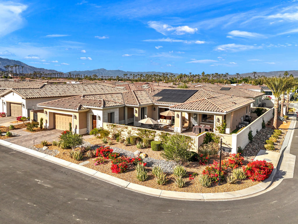 Welcome to The Province, a centrally located and serene community in the heart of Indian Wells. This stunning Lennar home, just 2 years young, boasts unobstructed panoramic views of Eisenhower Peak and the surrounding mountains from its sunny, private corner lot. Peace and tranquility define this residence, making it a perfect retreat in one of the desert's most desirable locations.Featuring 3 Bedrooms, 3.5 baths, and a versatile 19' x 18.4' flex space, the home offers endless possibilities--ideal for a den, office, study or even a 4th bedroom. Every detail has been thoughtfully curated, with no expense spared in the over $500,000 of upgrades.Step inside to an expansive open floor plan anchored by a gourmet chef's kitchen with Wolf and Sub-Zero appliances, waterfall quartz countertops, upgraded cabinetry, and designer finishes. Elegant tile flooring flows throughout, while the luxurious primary suite showcases a slab granite shower and vanity. Custom Window coverings, and electric blinds, and built-ins elevate the home's style and functionality.The courtyard is a private oasis, complete with a Pebble tec saltwater pool and spa, BBQ island, fire pit, and professionally designed low maintenance landscaping by Teserra. Whether entertaining or unwinding, the seamless indoor-outdoor living captures the essence of desert luxury.Additional highlights include a Culligan whole-house water purification system, fully paid solar, and an oversized garage with epoxy flooring, built-in cabinetry, refrigerator, and its own mini-split A/C system.Now vacant and move-in ready, this nearly brand-new home allows you to immediately enjoy the exclusive benefits of being an Indian Wells resident. Experience refined desert living at The Province- schedule your private showing today by calling Joe at 760-275-8800